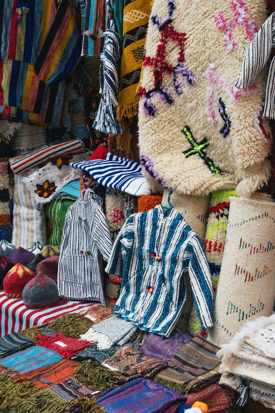 Clothing and textiles displayed at a market stall
