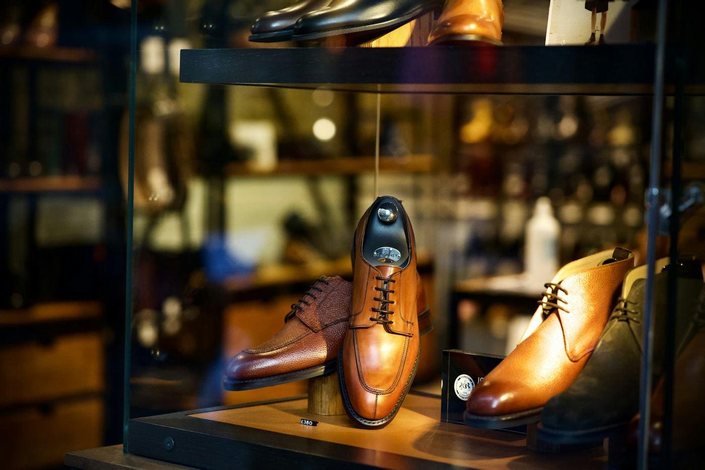 Men's shoes in a display case